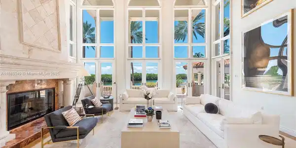 Image 4: Soaring ceilings and a working fireplace make this room very special.