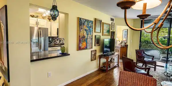 Image 4: There is a pass through from the kitchen to the dining area