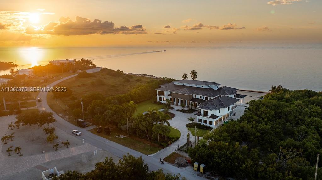 Image 2: Twilight Aerial From Oceanfront/Beach