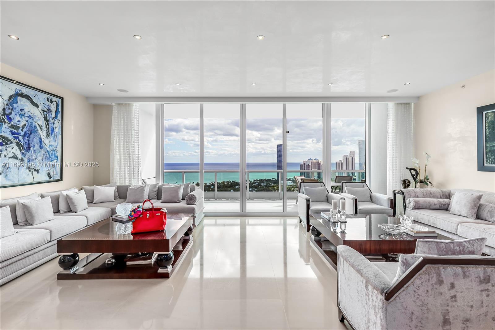 Image 1: Living room: Oversized, and comfortable.  High cielings and well kept marble floors