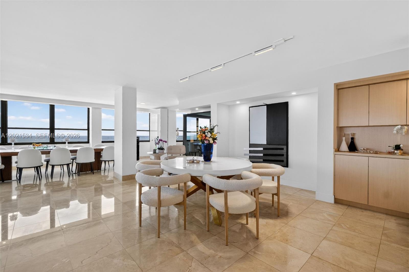 Image 4: Social Area with Built-in Bar and Cabinetry