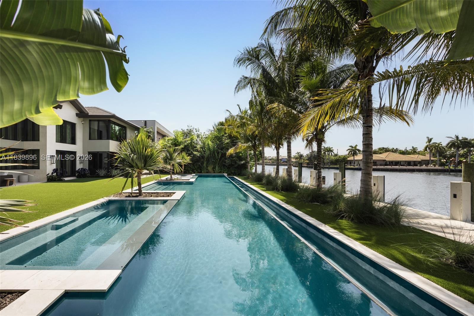 Image 2: Infinity pool alongside canal