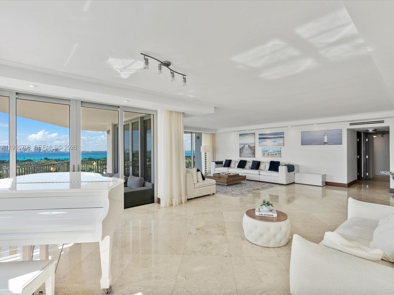 Image 1: Living room overlooking Miami skyline
