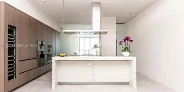Image 4: Snaidero Italian custom cabinetry in kitchen, Italian stone countertops, and Best Gaggenau appliance