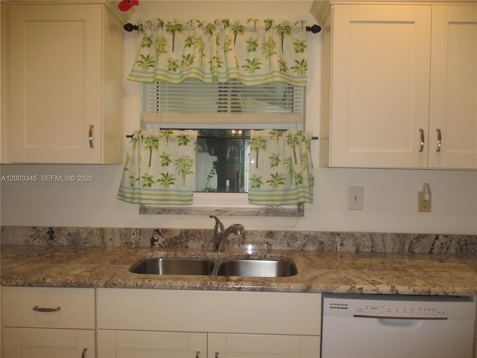 Image 2: Granite countertops/cream colored cabinets & dual sink
