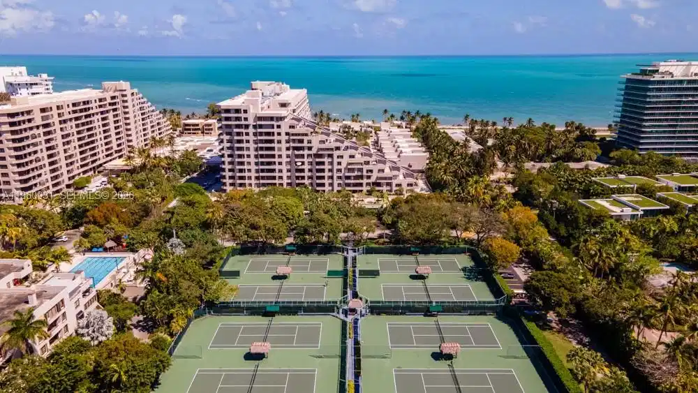 Image 1: Imagine relaxing at a resort with easy beach access, complete with umbrellas and chairs. Plus, you&r