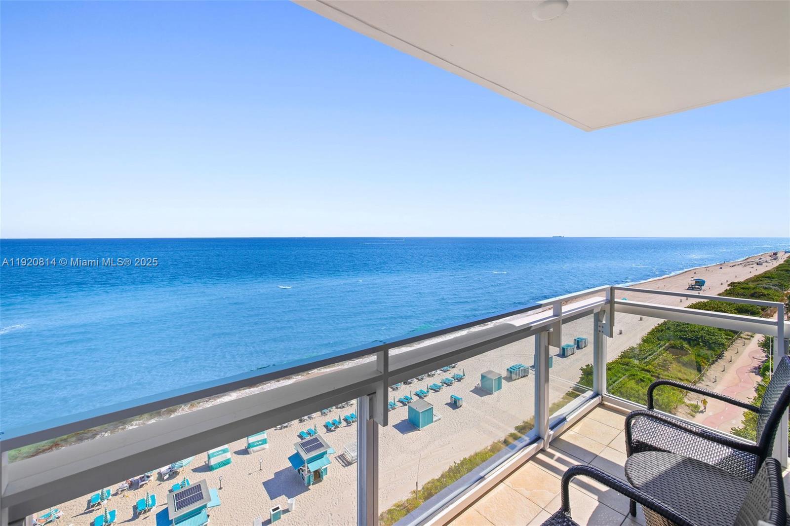Image 2: Balcony located off the primary bedroom with unobstructed views of the coastline