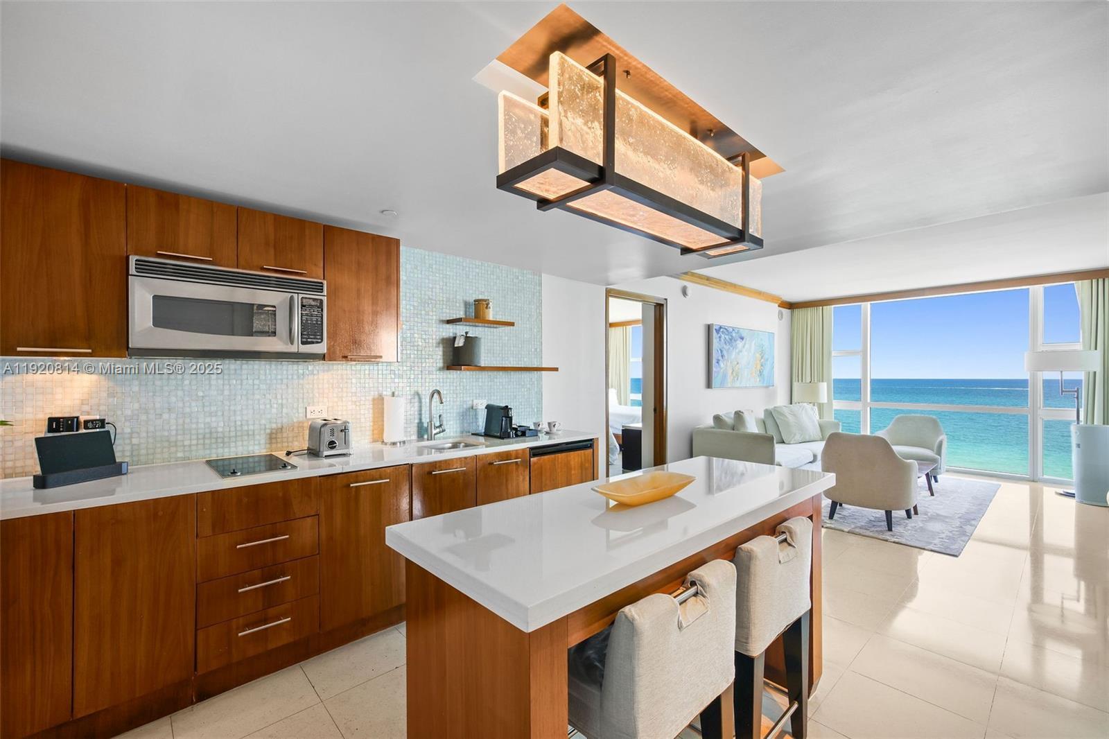 Image 3: Eat in kitchen with Miele cooktop, dishwasher, refrigerator