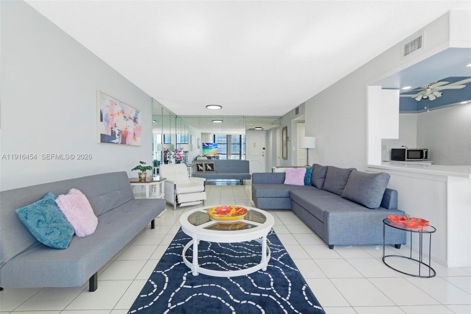 Image 4: Very bright and extremely spacious living area. Tile flooring. Unit can be purchased furnished too! 