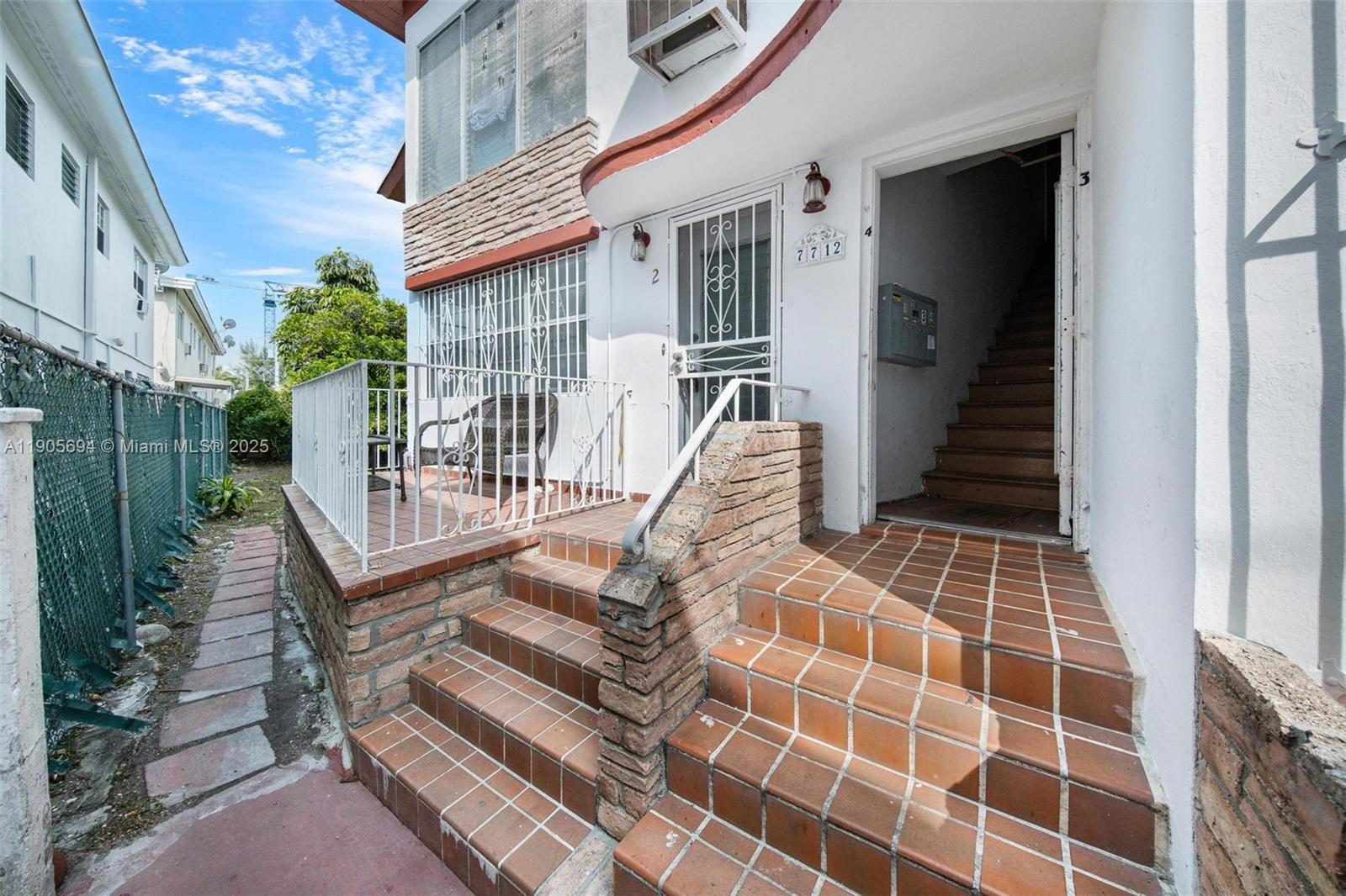 Image 3: entrance facing south, balcony faces garden