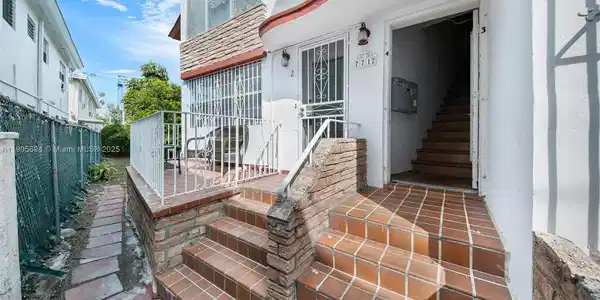 Image 3: entrance facing south, balcony faces garden