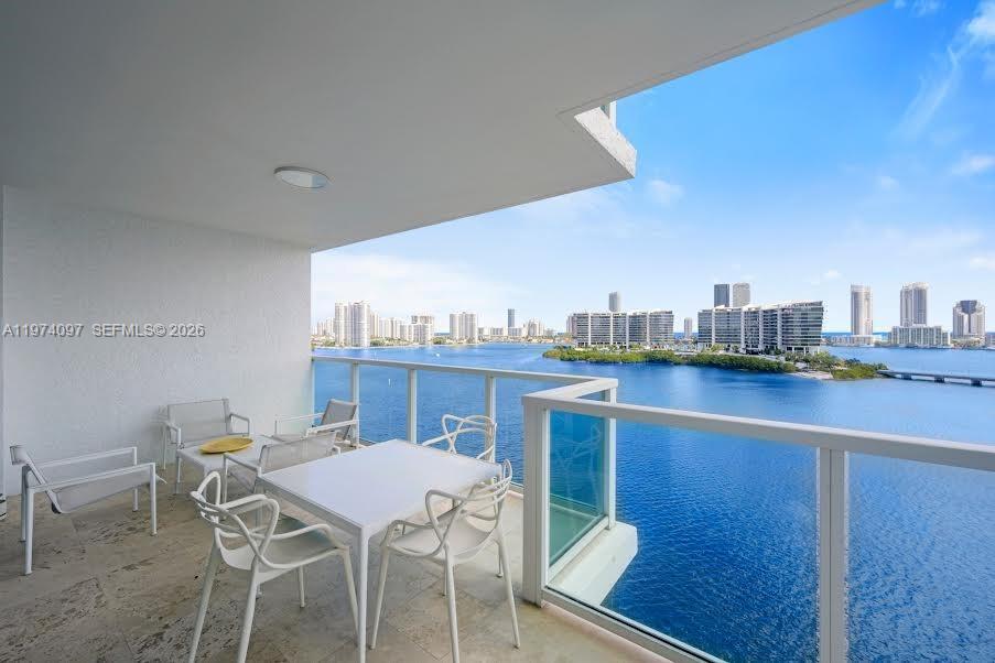 Image 2: Balcony size allows for entertaining and for socializing and dining outdoors.