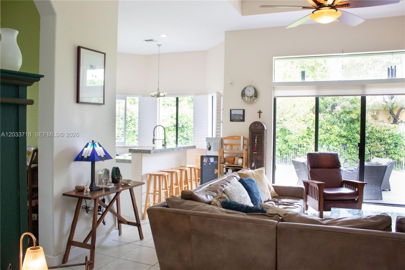 Image 4: Spacious Family Room adjacent to kitchen, and the entry way you see on the left, leads to the Formal