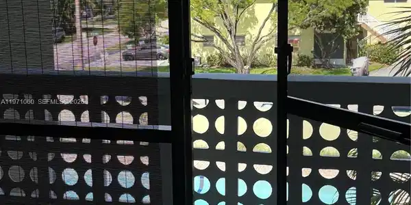 Image 2: screened balcony with view of pool