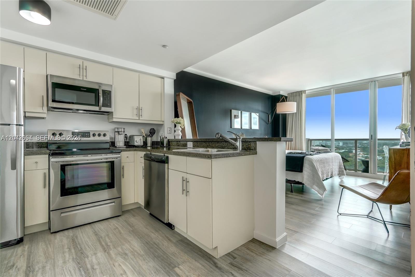 Image 2: Kitchen from Unit 1