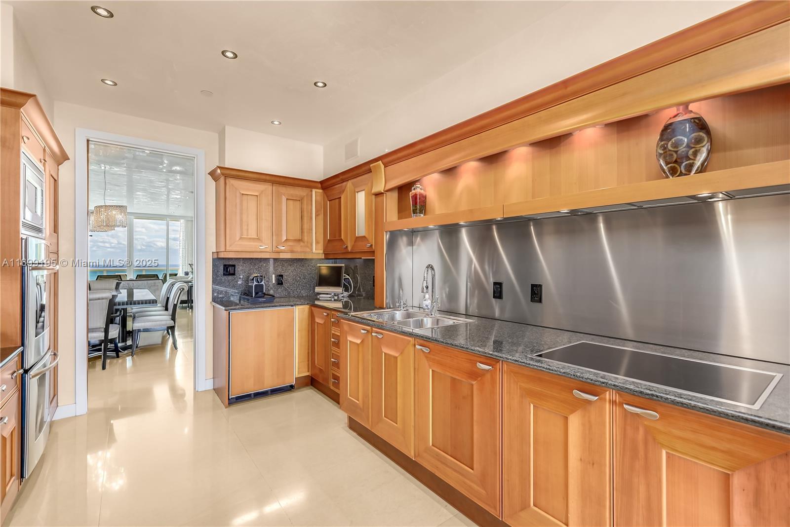Image 4: Bright and light, this kitchen has views and open to both sides of the Apt.