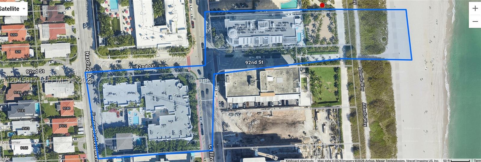 Image 4: Building cross the ocean with an access to the building on the beach.