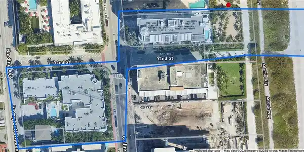 Image 4: Building cross the ocean with an access to the building on the beach.