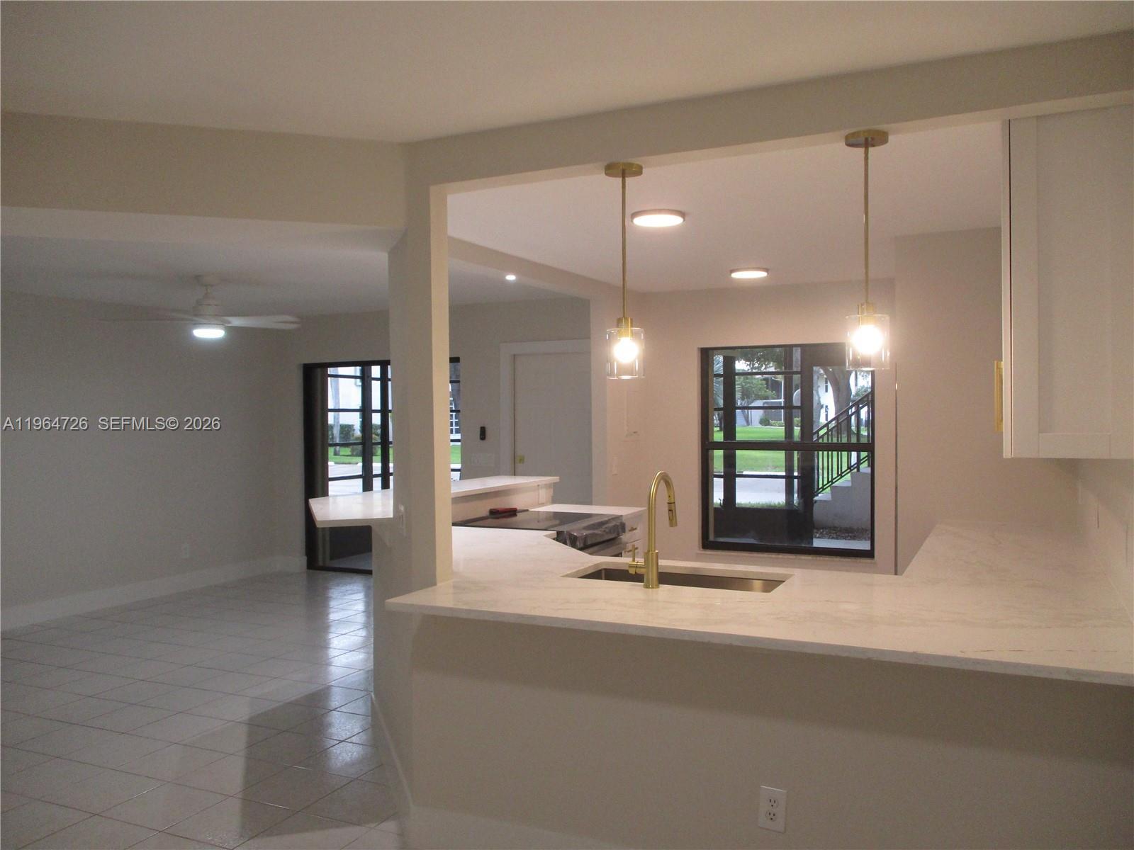 Image 4: VIEW FROM DINING AREA INTO LIVING ROOM