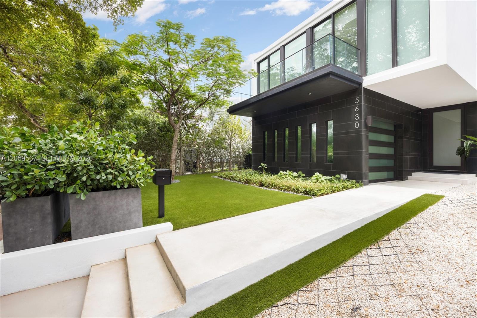 Image 3: walkway to the entrance door view