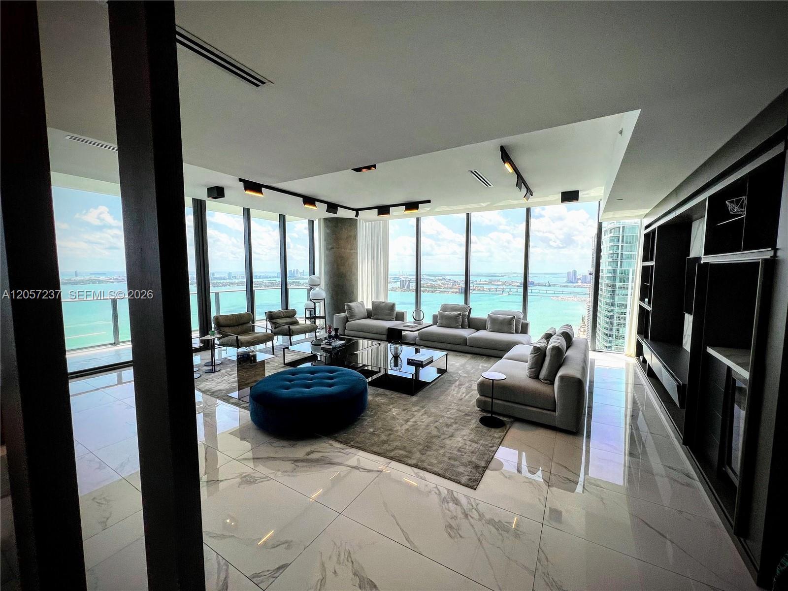 Image 3: Expanded living room, high end built ins