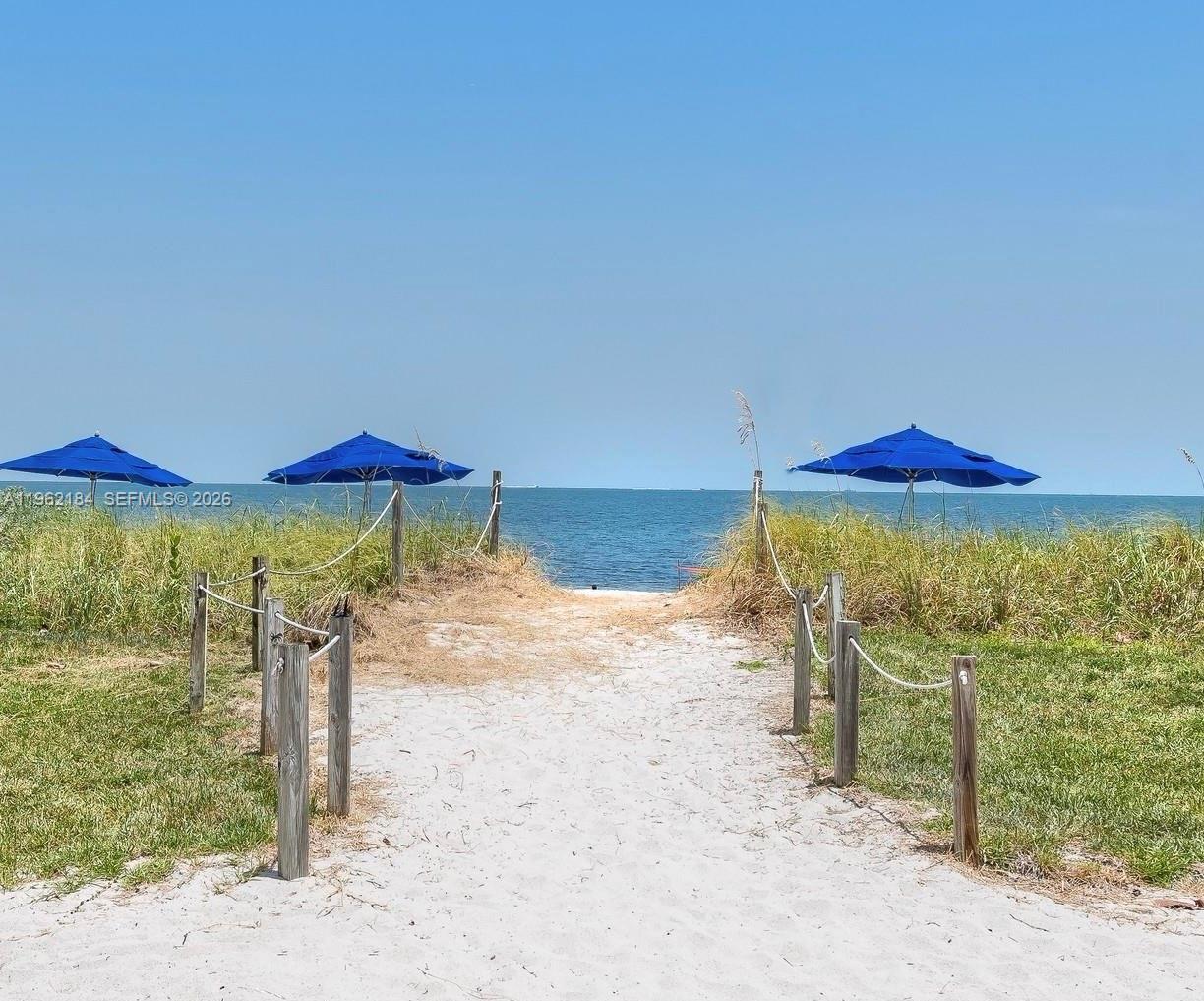 Image 1: Entrance to the Beach behind the Pool Patio