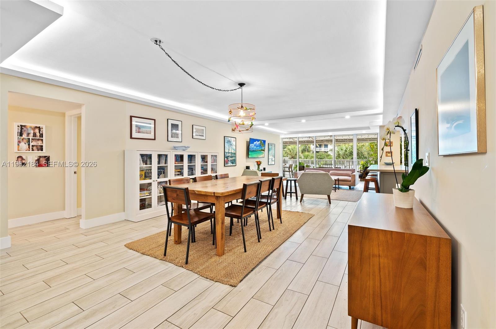 Image 3: Open Floor Plan Living/Dining/Kitchen and Patio