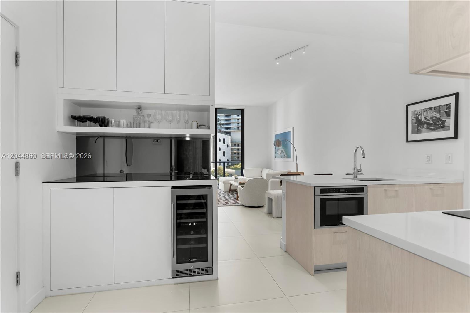Image 1: Den + Kitchen