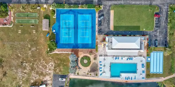 Image 2: Aerial View of Clubhouse Pool, Tennis, pickleball, shuffleboard courts
