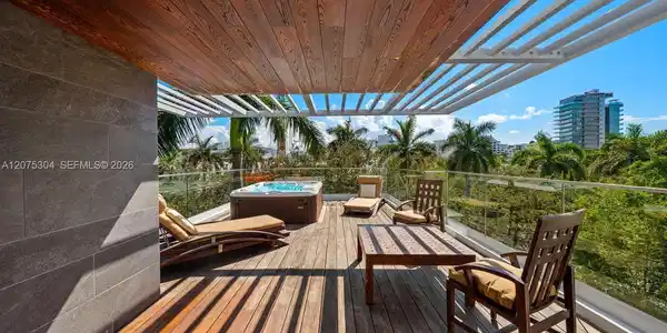 Image 4: Modern private deck surrounded by lush greenery &mdash; perfect Miami Beach outdoor living for enter