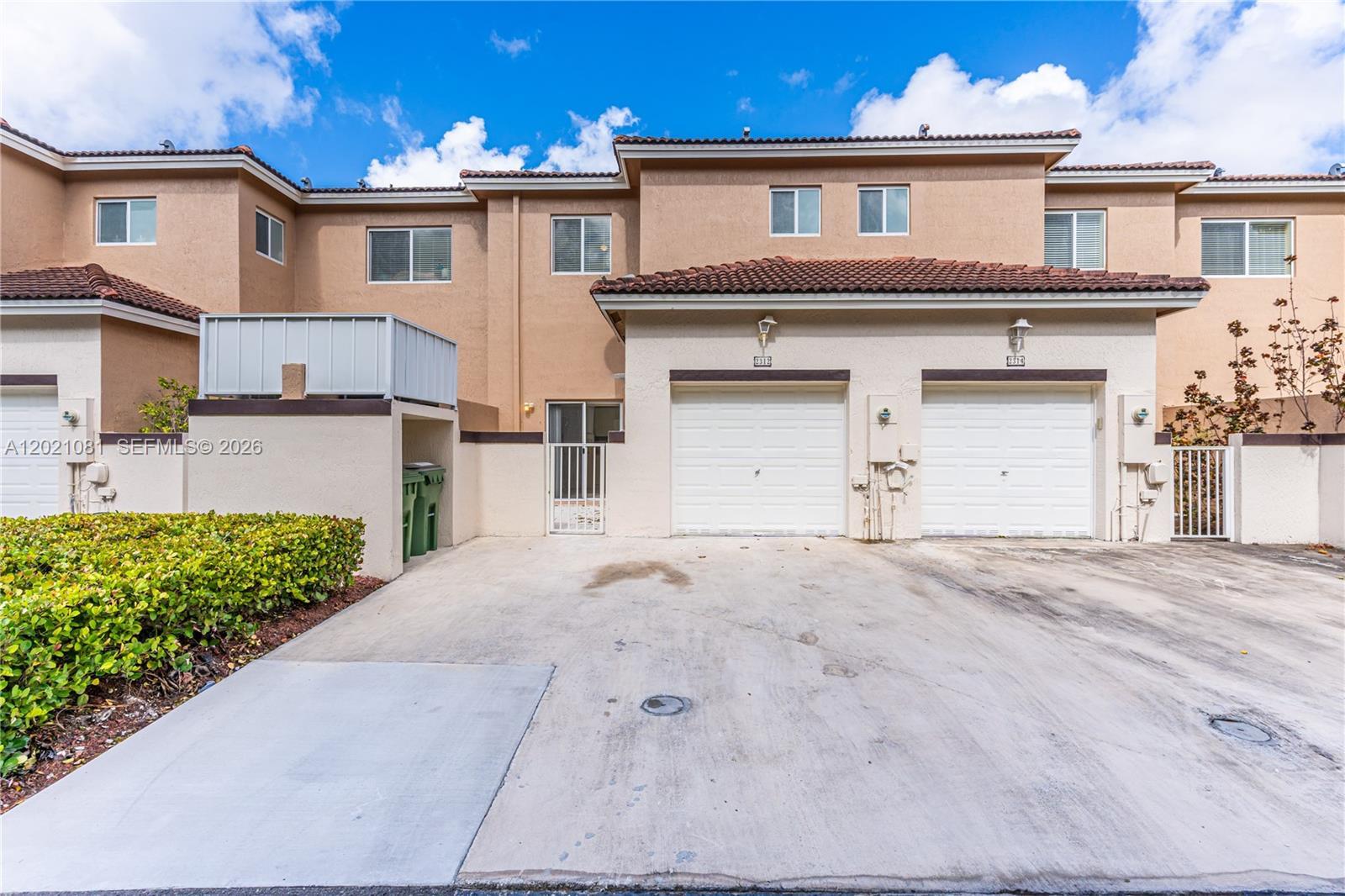 Image 1: Rear entrance featuring the garage.