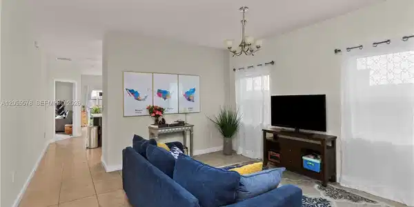 Image 4: Designed for effortless living, this open floor plan provides a seamless flow from the living area t