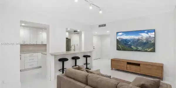 Image 4: Virtually Staged media Room -to Kitchen