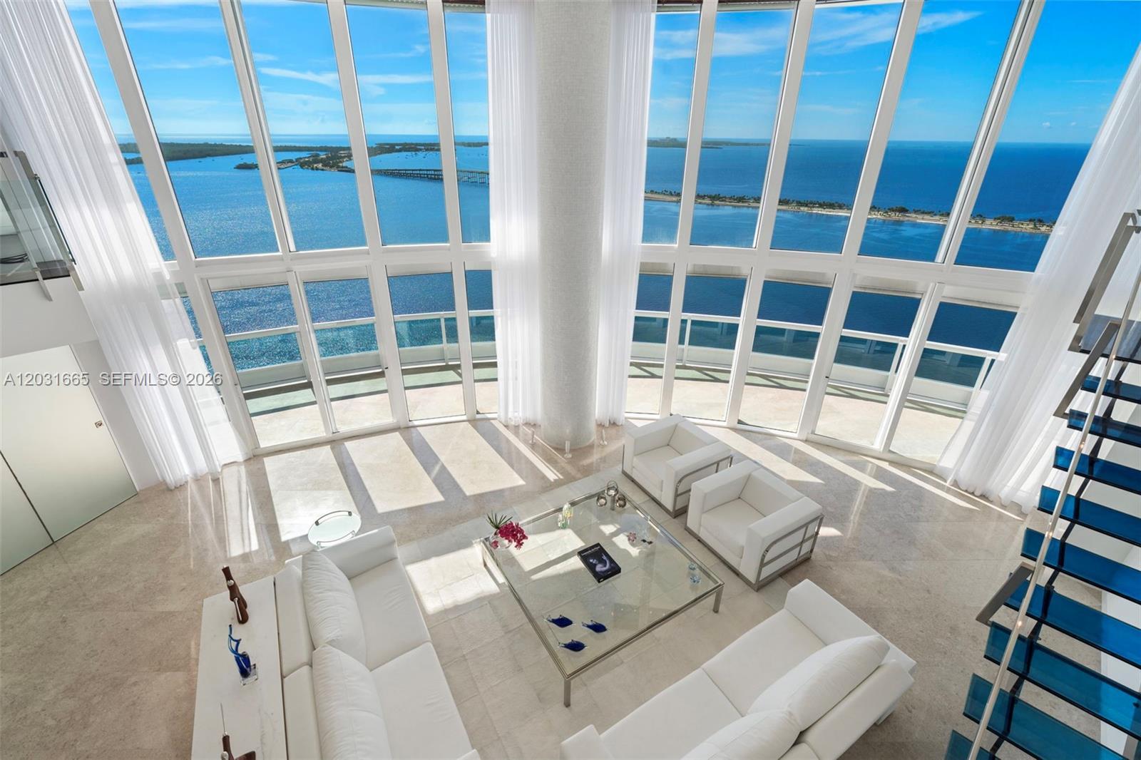 Image 1: Highest 2 level townhouse Living Room water views from second floor mezzanine