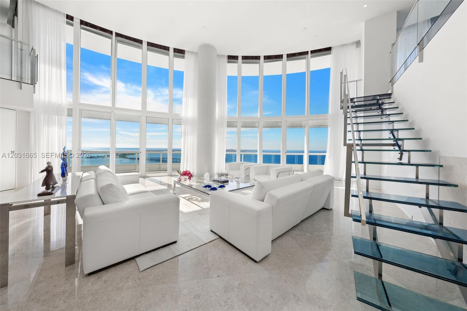 Image 4: Living Room with custom designed glass and stainless steel staircase