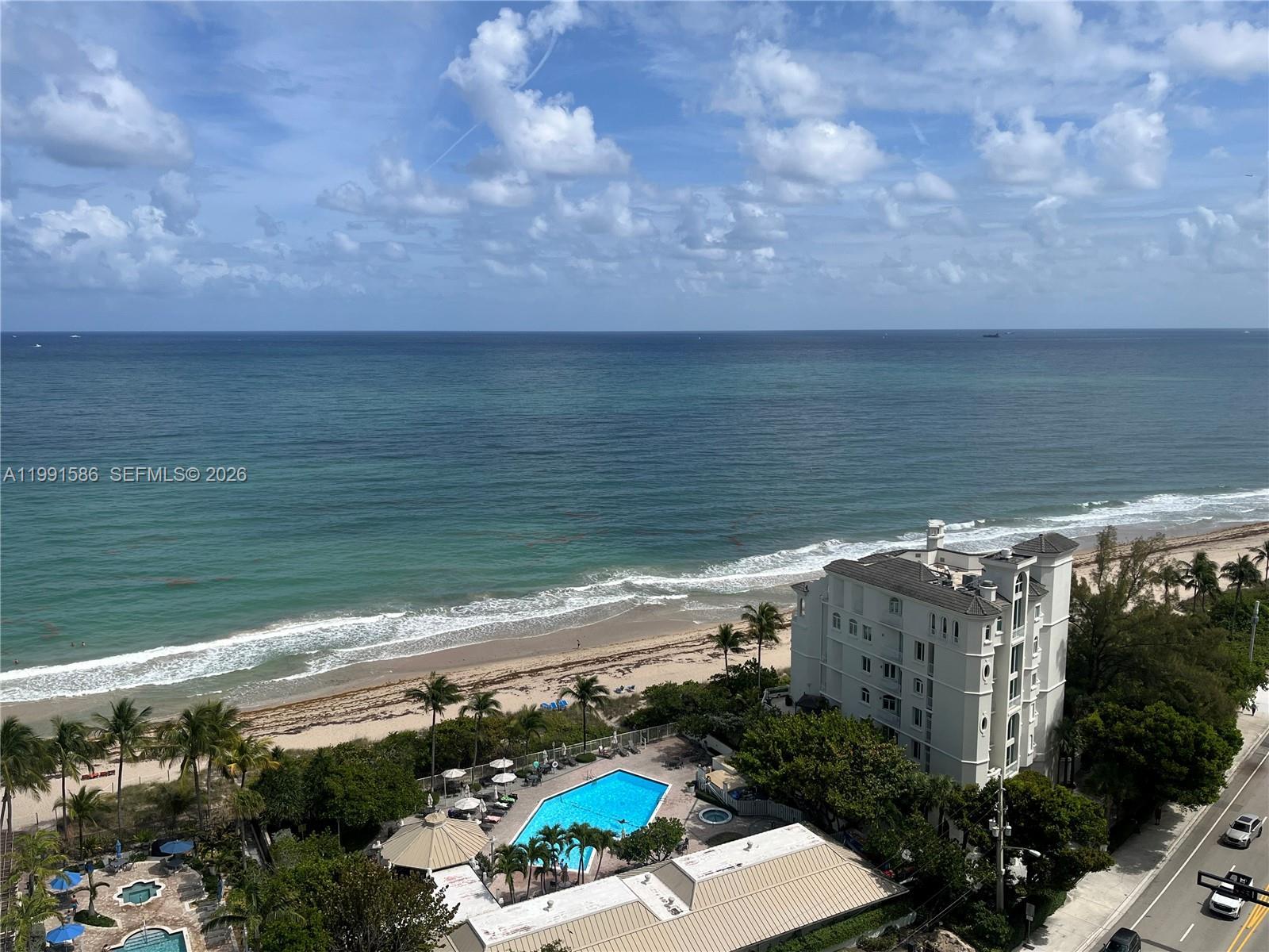 Image 4: Long ocean view to the South and of Clubhouse: heated pool, spa, cardio and weight rooms, BBQ, commu