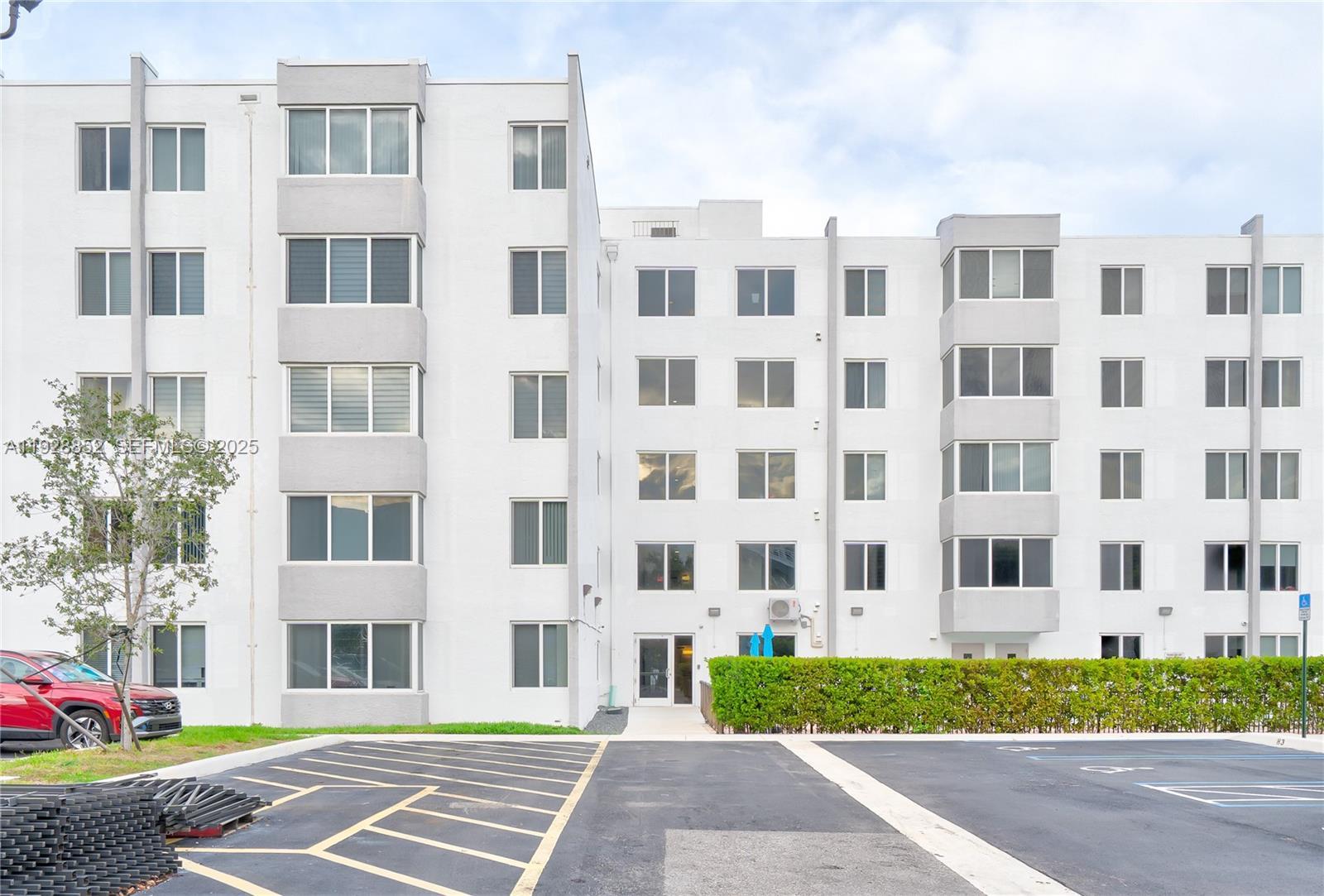 Image 2: Parking are and view of back entrance