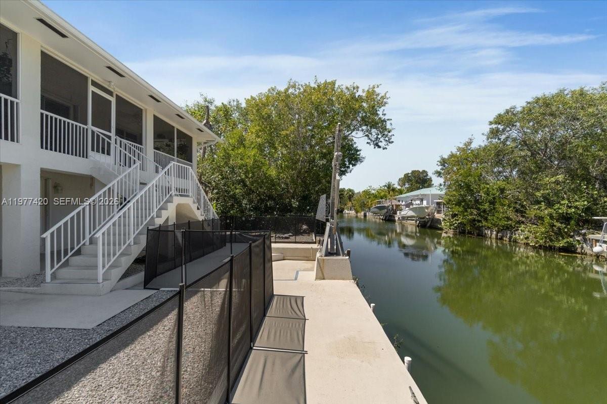 Image 3: Full concrete seawall along the canal&mdash;an increasingly rare feature in the Florida Keys where n