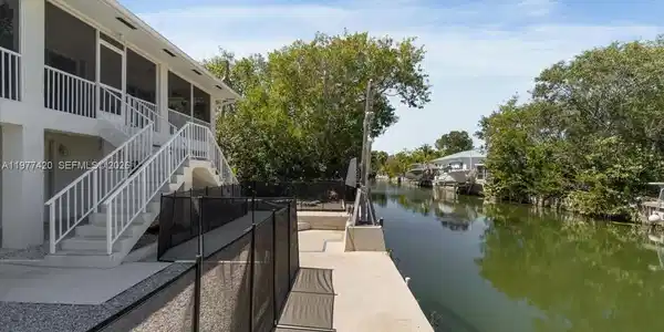 Image 3: Full concrete seawall along the canal&mdash;an increasingly rare feature in the Florida Keys where n