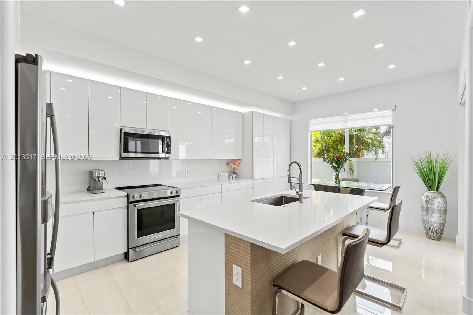 Image 3: Stainless steel appliances and plenty of light