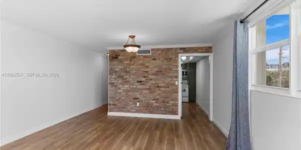 Image 4: Facing the hallway to room on the left and kitchen on the right