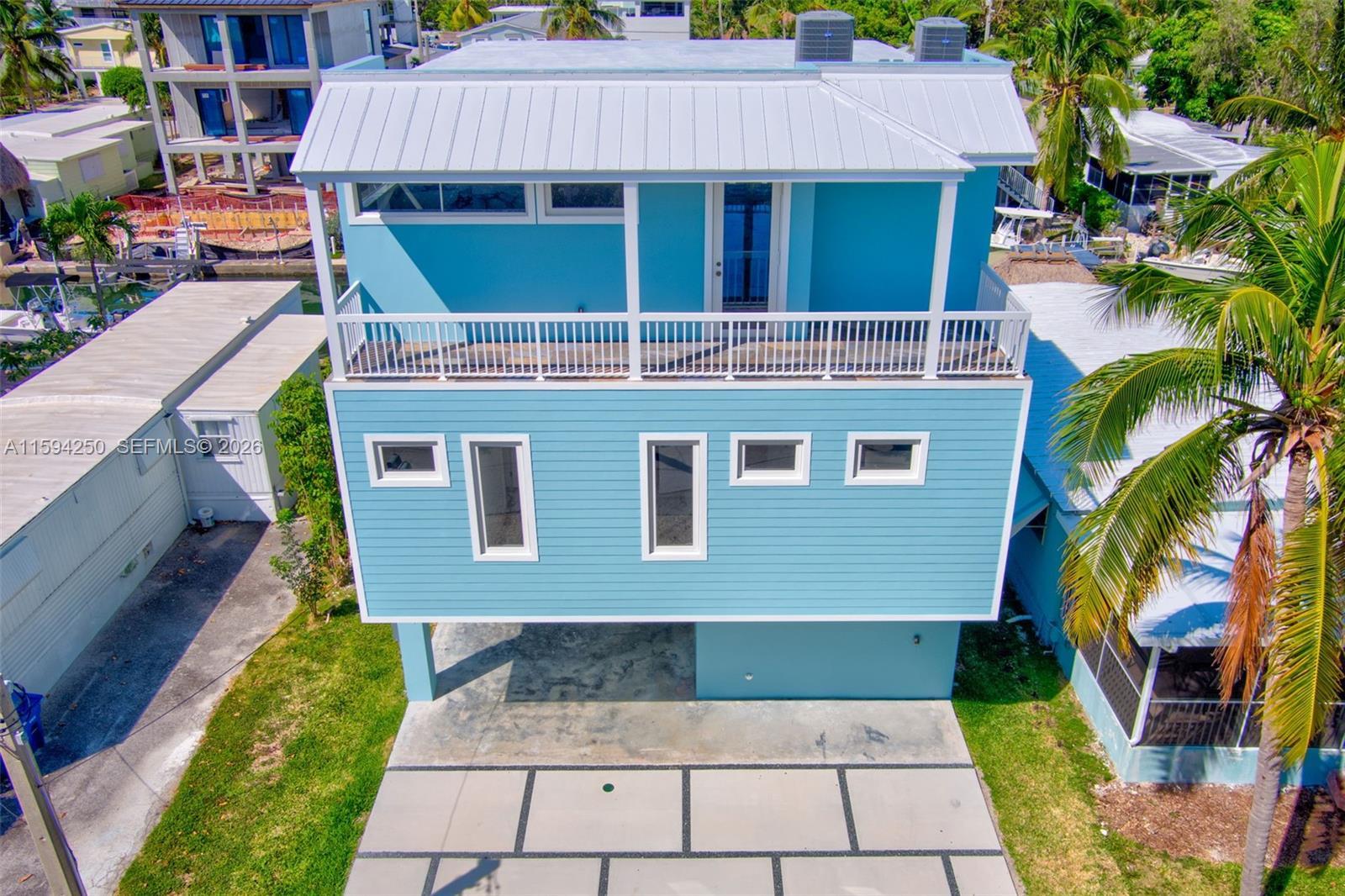 Image 3: Front of home. Balcony top floor