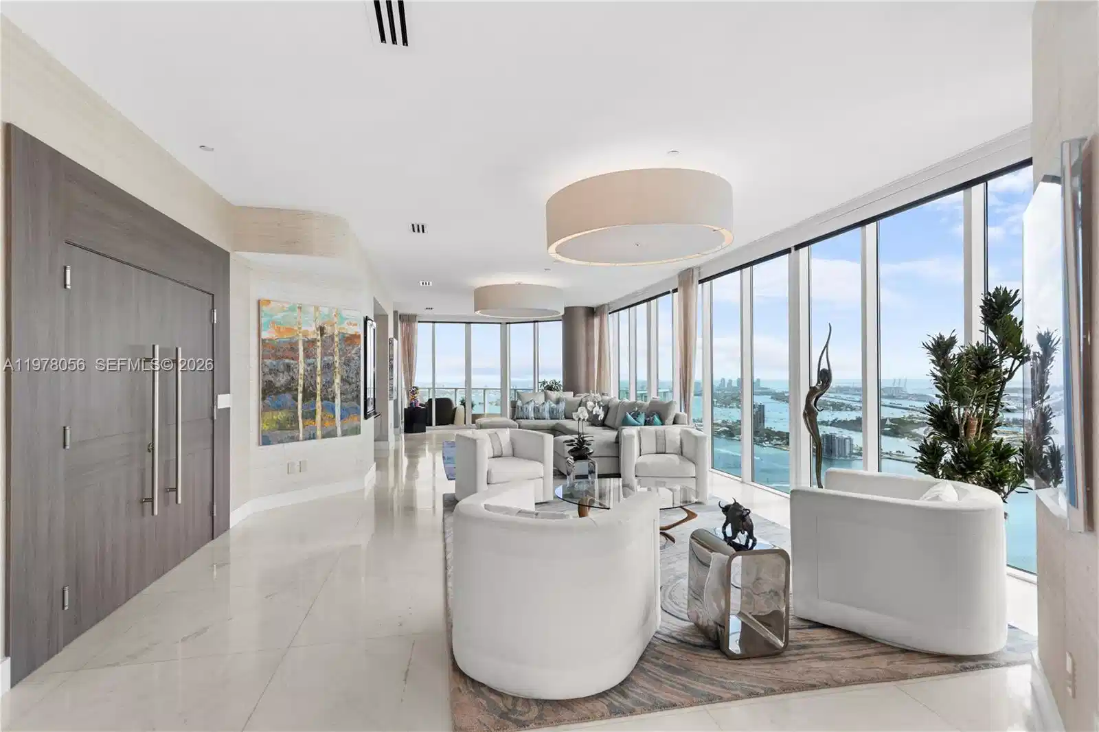 Image 1: Living area framed by floor-to-ceiling glass