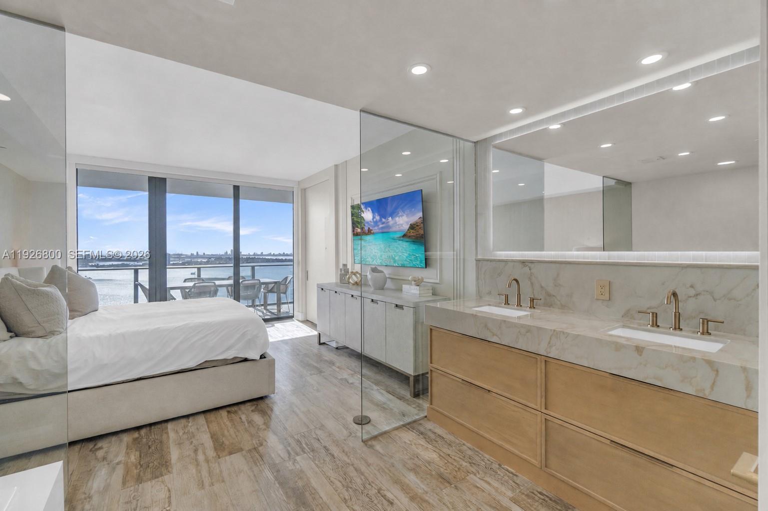 Image 2: Primary Bedroom with Ocean and Bay Views