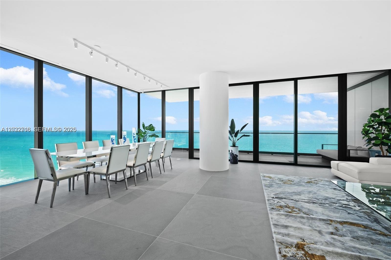 Image 2: Direct ocean views from the spacious ldining area with floor-to-ceiling glass.