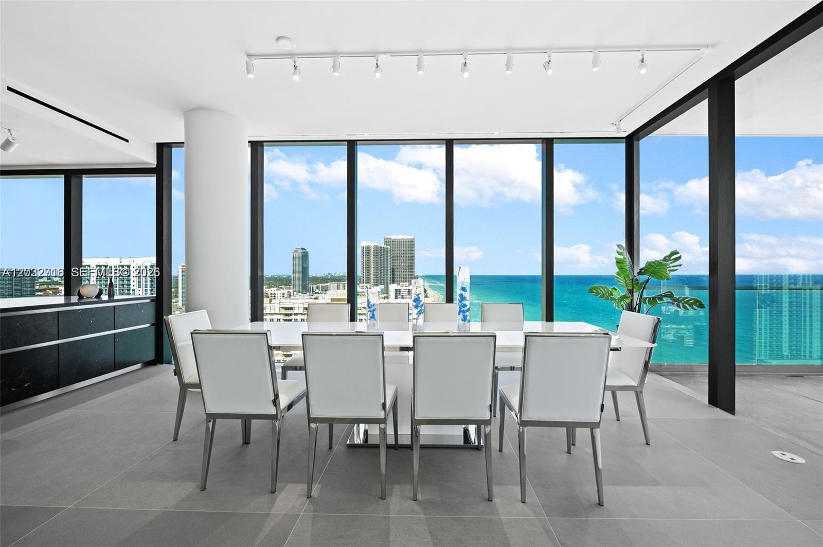 Image 4: Direct ocean views from the spacious ldining area with floor-to-ceiling glass.
