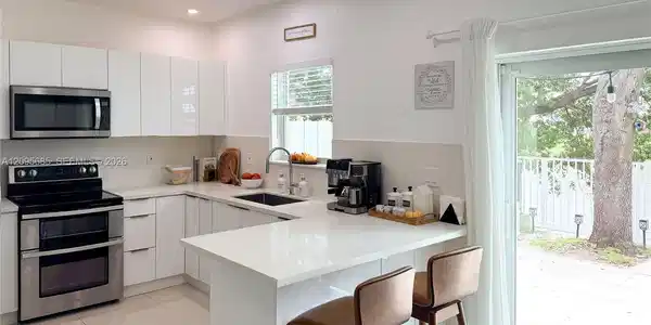 Image 2: Kitchen area with lake views.