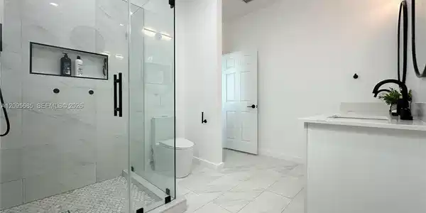 Image 4: Fully remodeled master bathroom