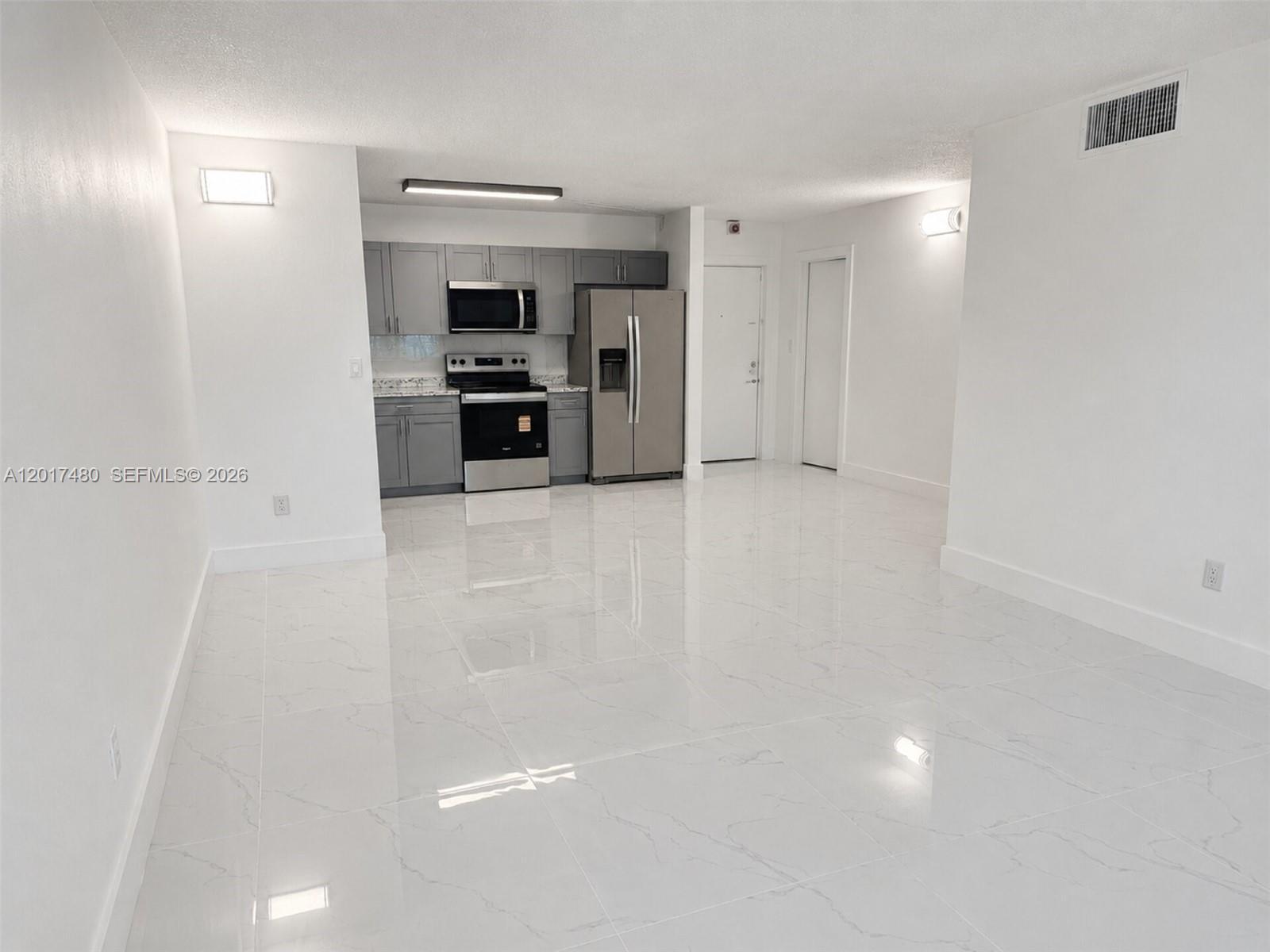 Image 3: Spacious and Bright Living Area.
