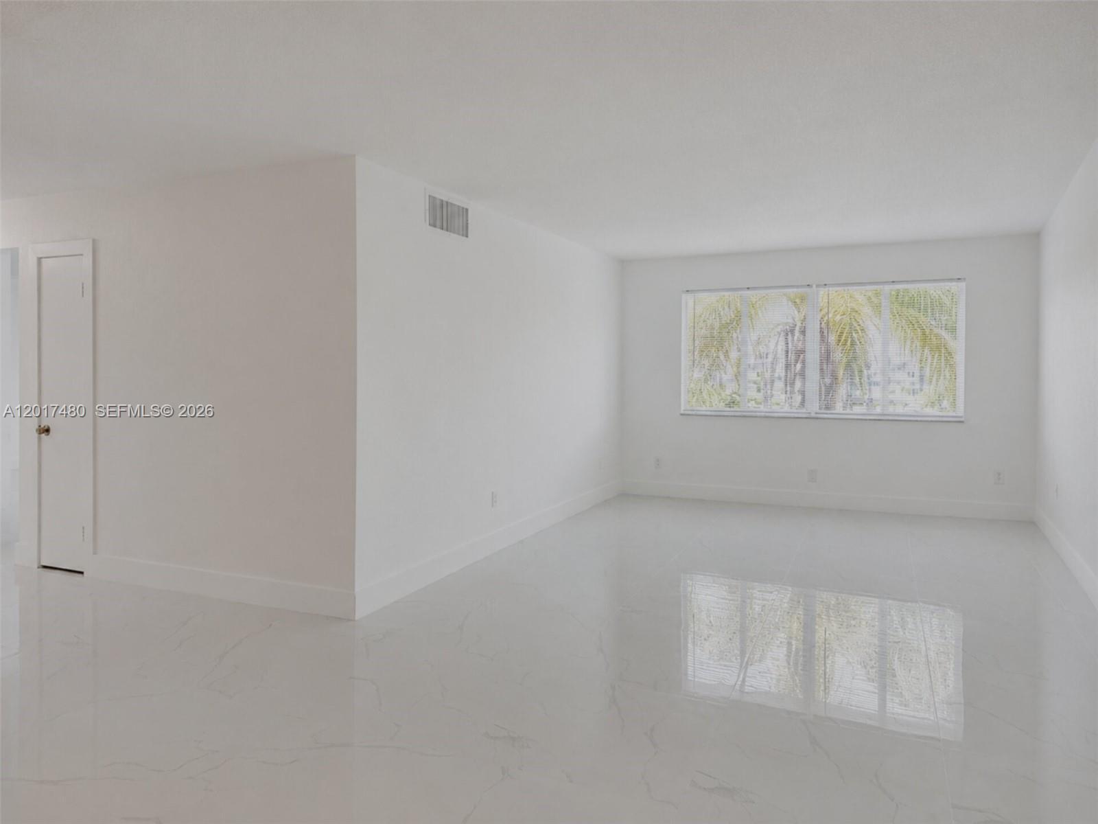 Image 4: Spacious and Bright Living Area.